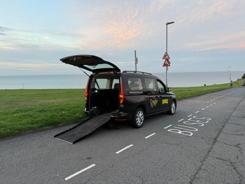 247 Taxis wheelchair accessible vehicle with rear ramp deployed